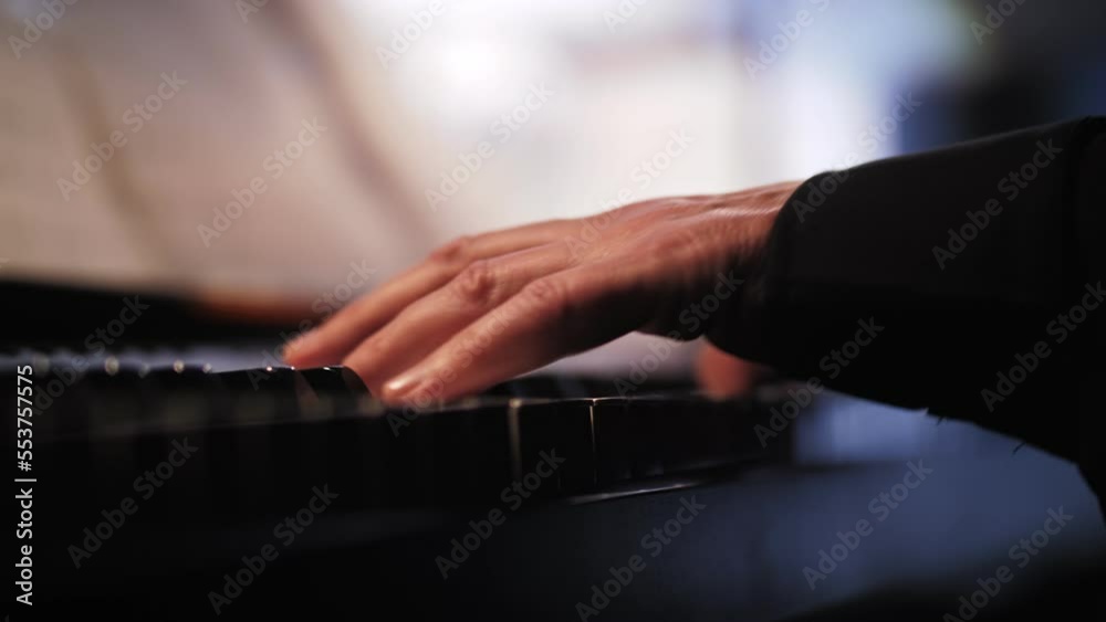 a man playing an electronic piano a man playing an electronic piano
