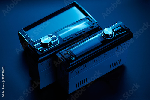 Black car radio tape recorder close-up on black background, audio system, control panel photo