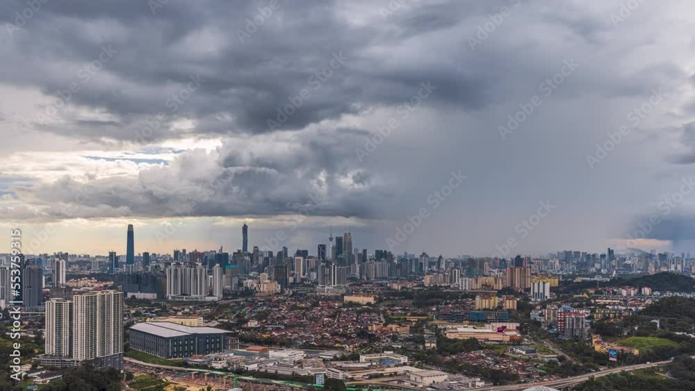 Monsoon cityscape time lapse with Dark clouds rain curtains and busy expressway against the Kuala Lumpur city skyline at sunset from afar in Malaysia. Zoom in motion timelapse. Prores 4KUHD. Monsoon cityscape time lapse with Dark clouds rain curtains and busy expressway against the Kuala Lumpur city skyline at sunset from afar in Malaysia. Zoom in motion timelapse. Prores 4KUHD.
