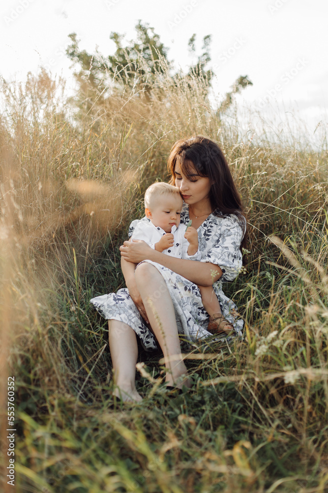 Happy young family spend time together outside in green nature Happy young family spend time together outside in green nature