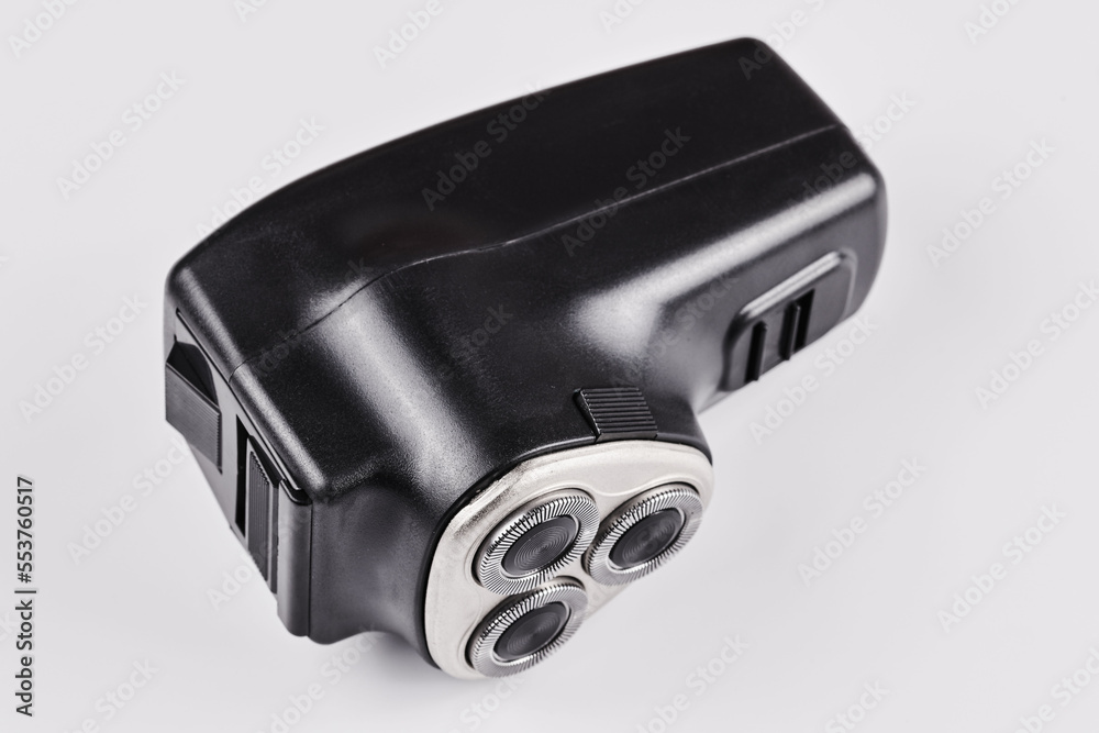Black male electric razor closeup isolated on white background Black male electric razor closeup isolated on white background