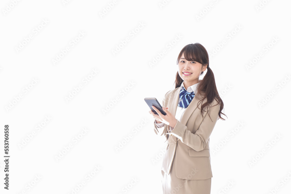 スマホアプリを使う制服姿の学生 スマホアプリを使う制服姿の学生