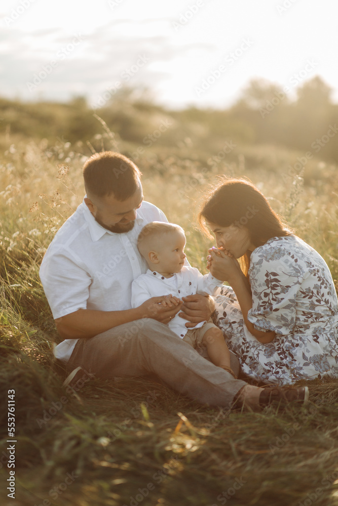 Happy young family spend time together outside in green nature Happy young family spend time together outside in green nature