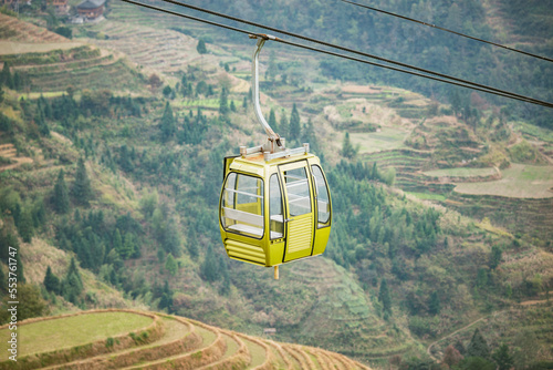 Cable car approaches to the top of the mountain.