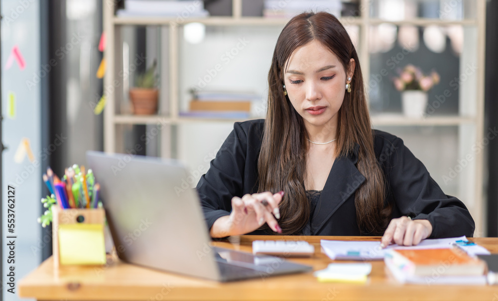 Portrait of business asian woman Accounting using calculating income-expenditure and analyzing real estate investment data report Financial and tax systems concept. Portrait of business asian woman Accounting using calculating income-expenditure and analyzing real estate investment data report Financial and tax systems concept.