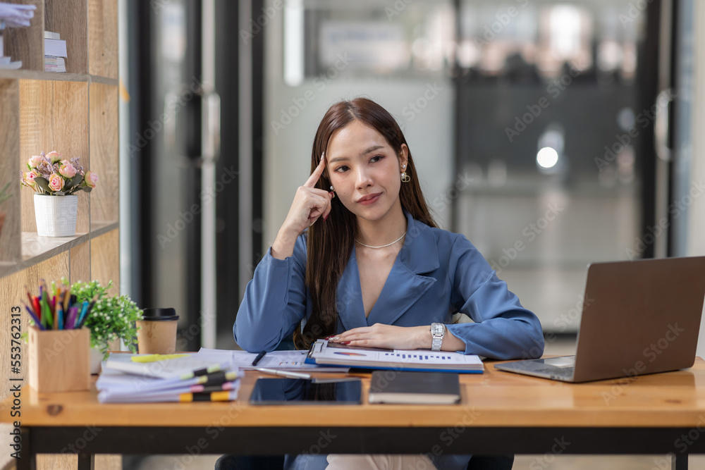 Portrait of business asian woman Accounting using calculating income-expenditure and analyzing real estate investment data report Financial and tax systems concept. Portrait of business asian woman Accounting using calculating income-expenditure and analyzing real estate investment data report Financial and tax systems concept.