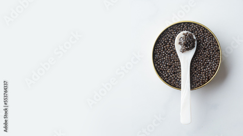 Black caviar in a mother-of-pearl spoon