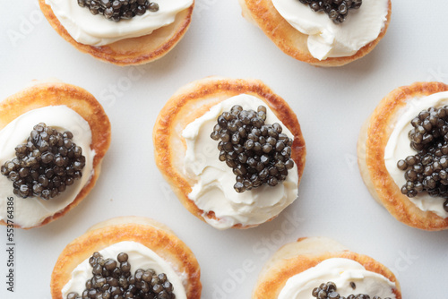 Black caviar appetizers mini pancakes