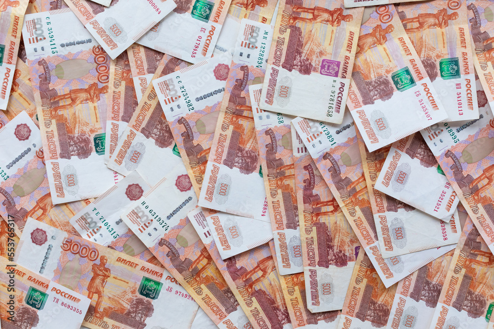 Money background. Banknotes of Russian rubles. Russian money with a face value of five thousand rubles. The concept of Finance. Cash loan. Top view, flat lay. Money background. Banknotes of Russian rubles. Russian money with a face value of five thousand rubles. The concept of Finance. Cash loan. Top view, flat lay.