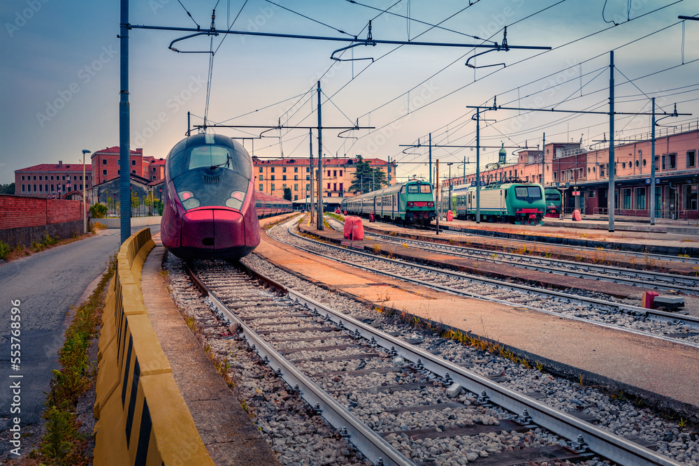 Modern trains on Station in Venice. Early morning spring in Italy, Europe. Traveling concept background.