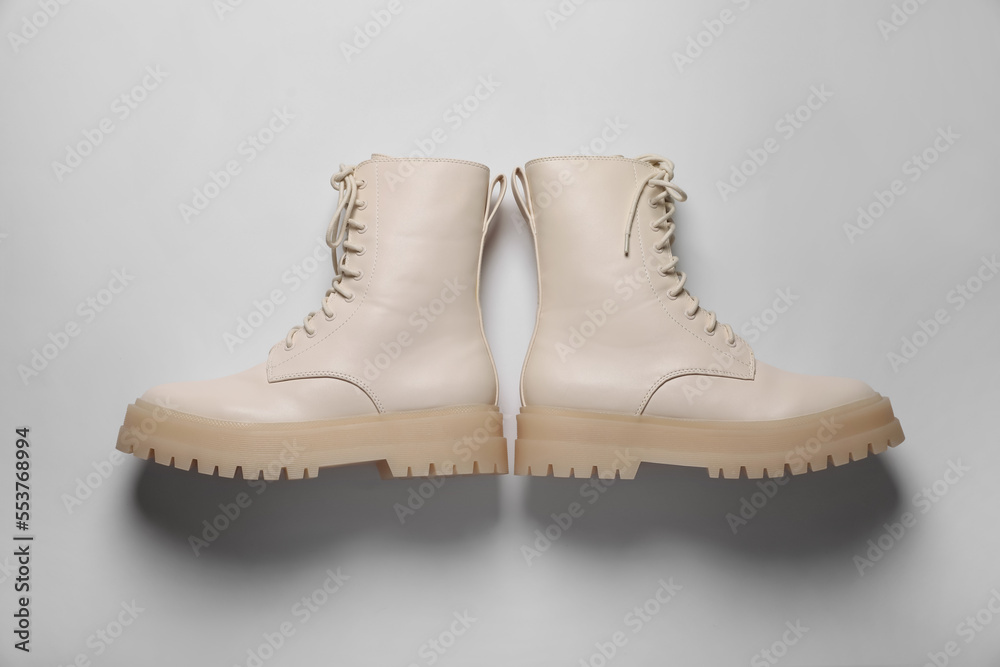 Pair of stylish leather shoes on beige background, flat lay Pair of stylish leather shoes on beige background, flat lay