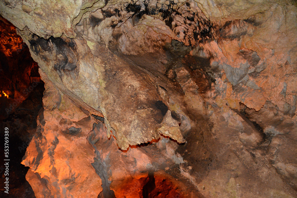 Fototapeta premium dark cave with rocky wall isolated, close-up