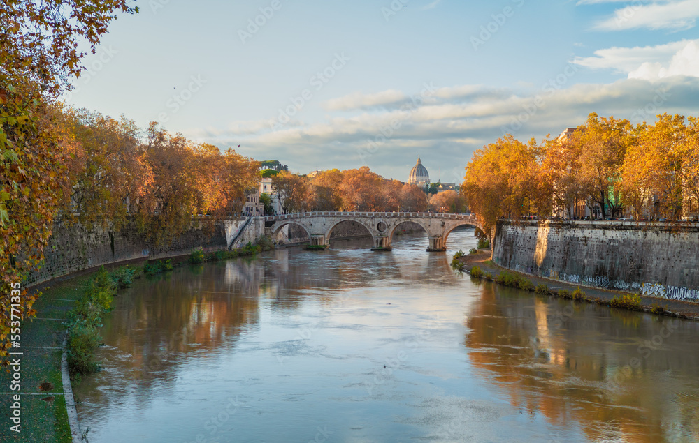 Rome (Italy) - The Tiber river and the monumental Lungotevere street in the metropolitan capital of Italy. Here in particular the Saint Peter in Vatican dome.