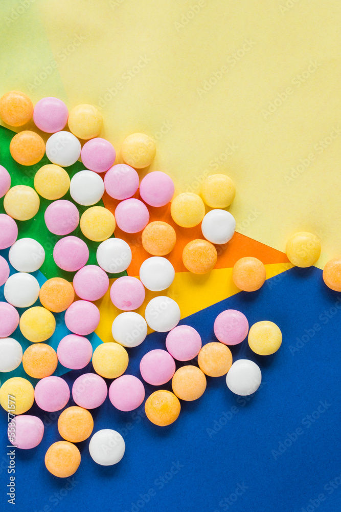 Candy on the colorful background, high angle view