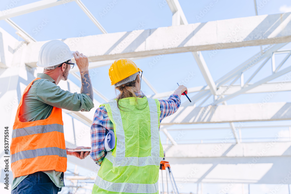 Engineer builder architect team working check roof beam construction progress structure building.