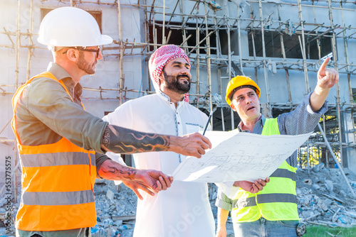 Canvas Print Engineer team group with Arab business estate project manager check floor plan o