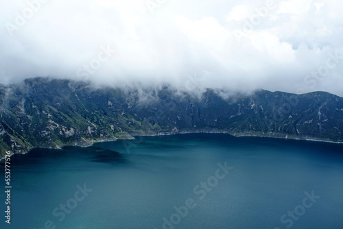 Clouds rolling into the caldera above Quilotoa Lake near Latacunga, Ecuador