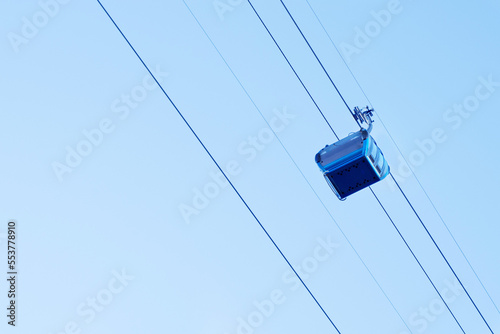 Cable car in Batumi, Georgia. Blue cabin move on the cable car against the sky