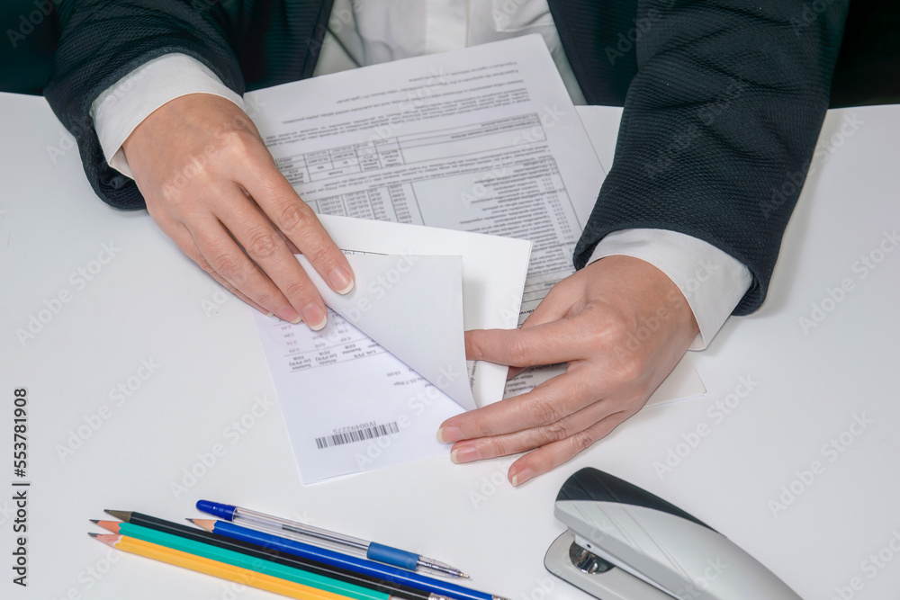 Tax accountant-consultant A woman keeps a record of invoices.