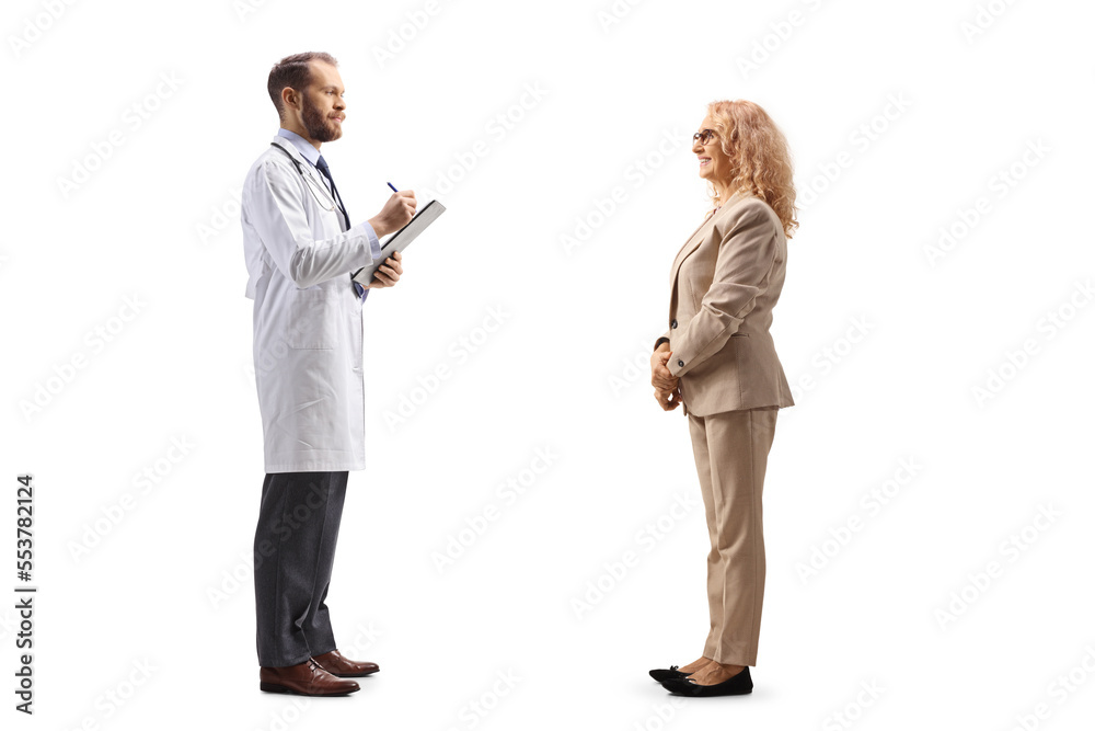 Full length profile shot of a doctor writing a prescription to a woman