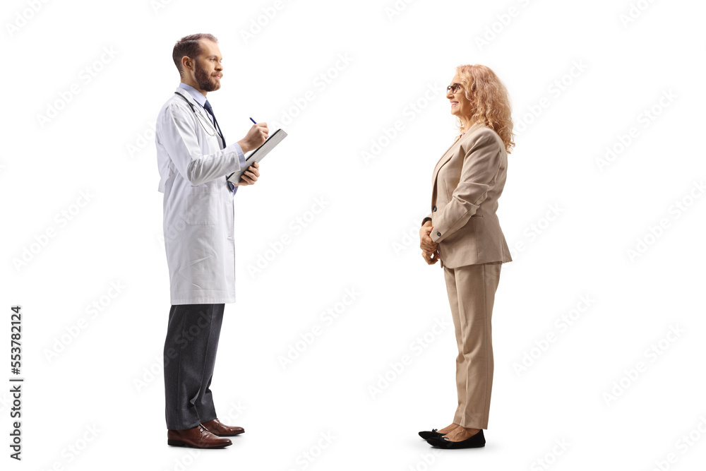 Full length profile shot of a doctor writing a prescription to a woman Full length profile shot of a doctor writing a prescription to a woman