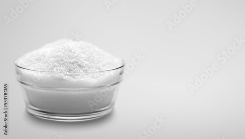 Abstract white powder on light background photo