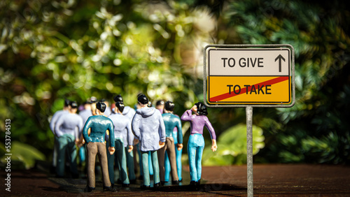 Fotografia Street Sign to TO GIVE versus TO TAKE