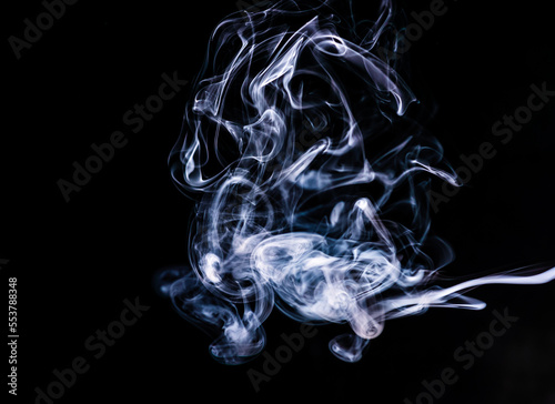 Smoke on an isolated black background. Studio macro photography. Close-up .