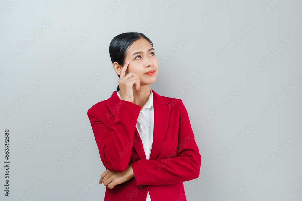 Pretty lovely manager lady successful business asian women in red suit isolated over background. Thinking and looking for something Pretty lovely manager lady successful business asian women in red suit isolated over background. Thinking and looking for something