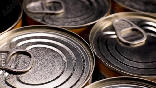 Metal food cans spinning. Tourist food, military and humanitarian aid