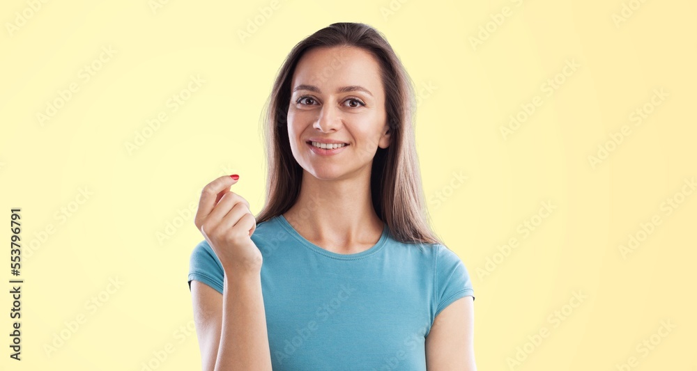 Young happy woman posing on background Young happy woman posing on background