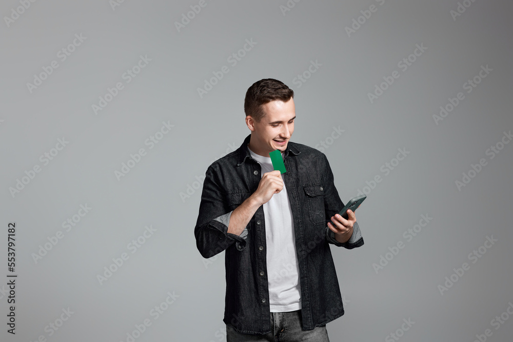 handsome man with smartphone and credit bank card handsome man with smartphone and credit bank card