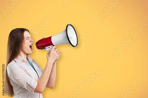 Excited happy lady shouting in megaphone