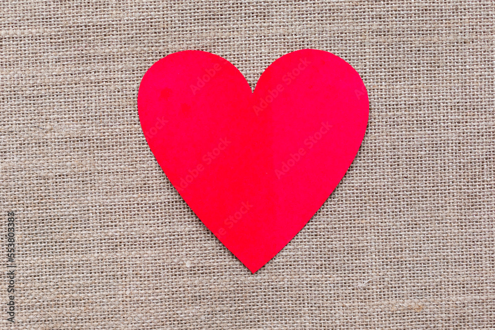 Paper craft heart on a burlap background. Valentine flat lay with red heart. Paper craft heart on a burlap background. Valentine flat lay with red heart.