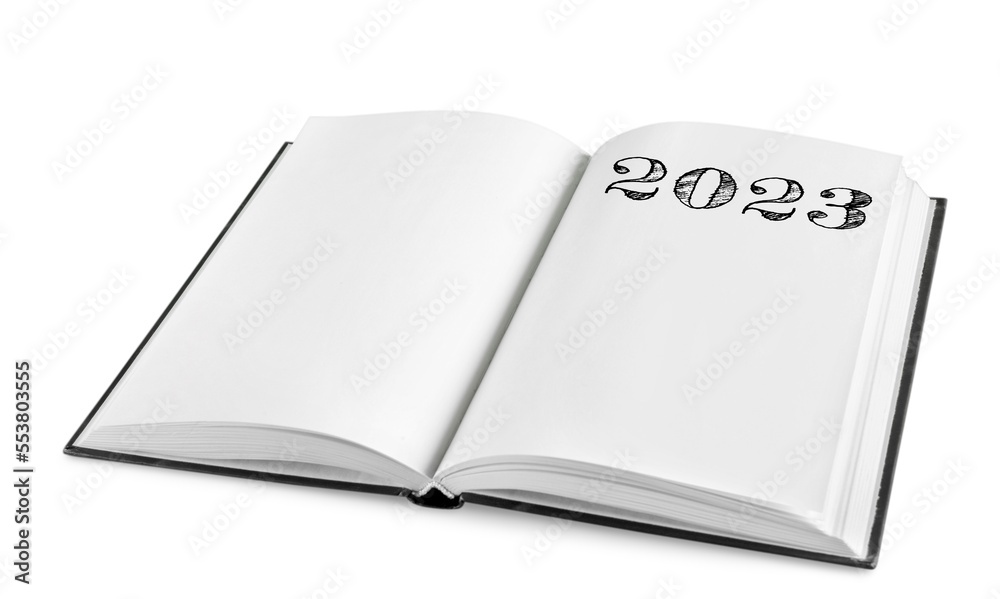 Fototapeta premium New year 2023 concept on the notepad.