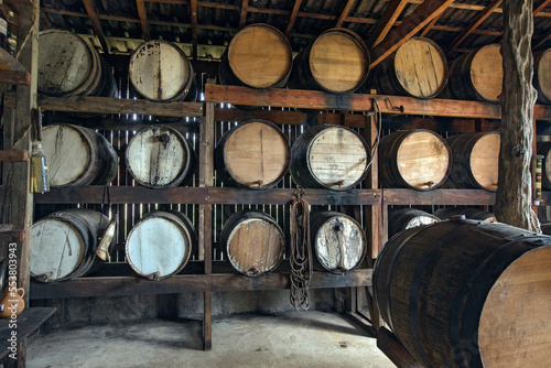 Sugarcane liquor, or cachaca in portuguese, resting in the barrel in the still for aging on countryside  of Brazil photo