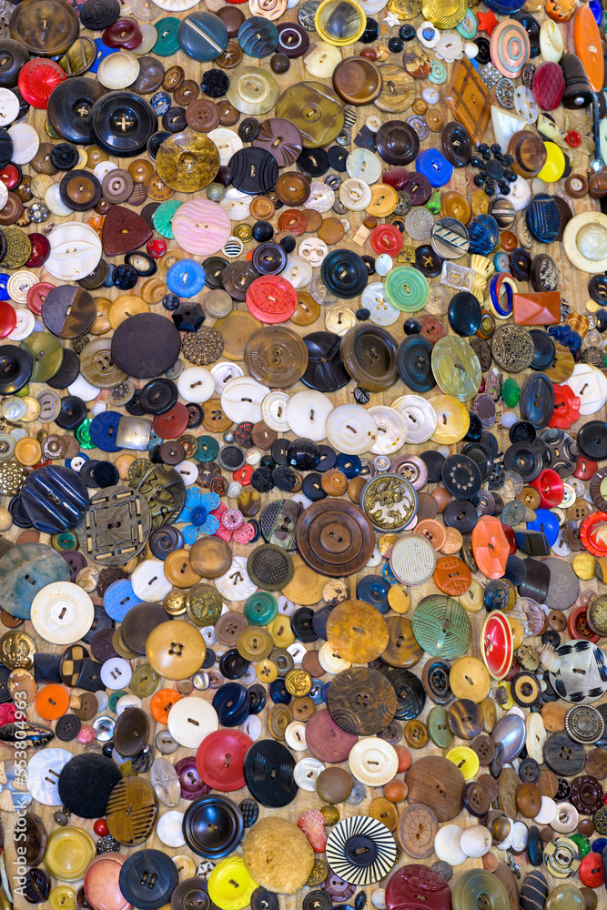 Obraz premium Large collection of colorful plastic buttons in pile for sewing