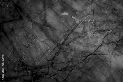 Black marble texture and scratches.