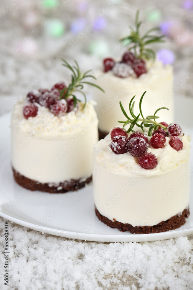 Mousse cakes with coconut cream and Greek yogurt over chocolate cake are the perfect dessert. Add whipped cream and berries. Treat friends and loved ones on Christmas or New Year's Eve Mousse cakes with coconut cream and Greek yogurt over chocolate cake are the perfect dessert. Add whipped cream and berries. Treat friends and loved ones on Christmas or New Year's Eve