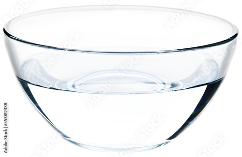 Glass bowl full of clear water on background