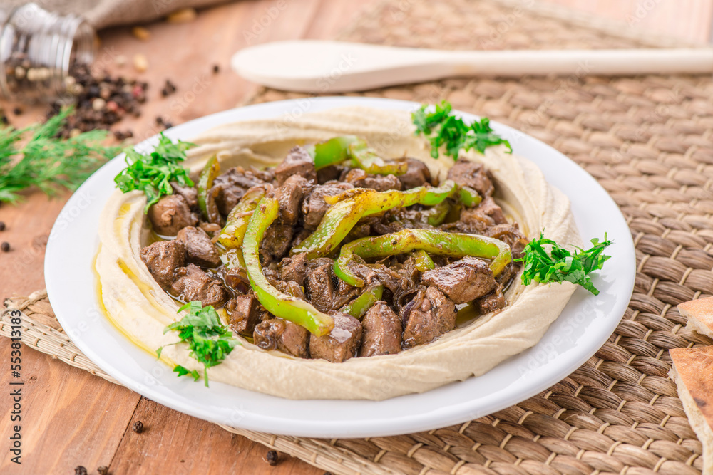 Liver Hummus served in dish isolated on table side view of arabic food Liver Hummus served in dish isolated on table side view of arabic food