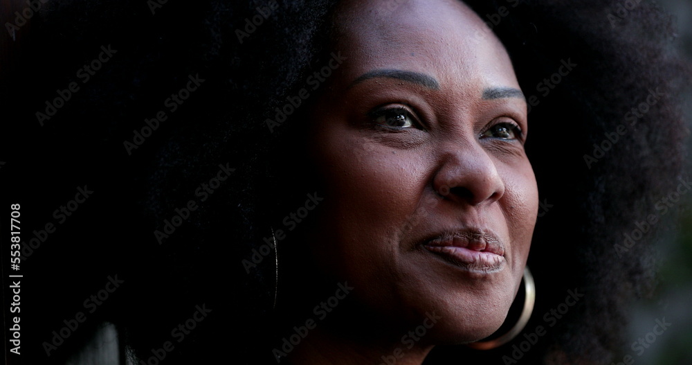 Positive African woman smiling. Black person portrait face close-up