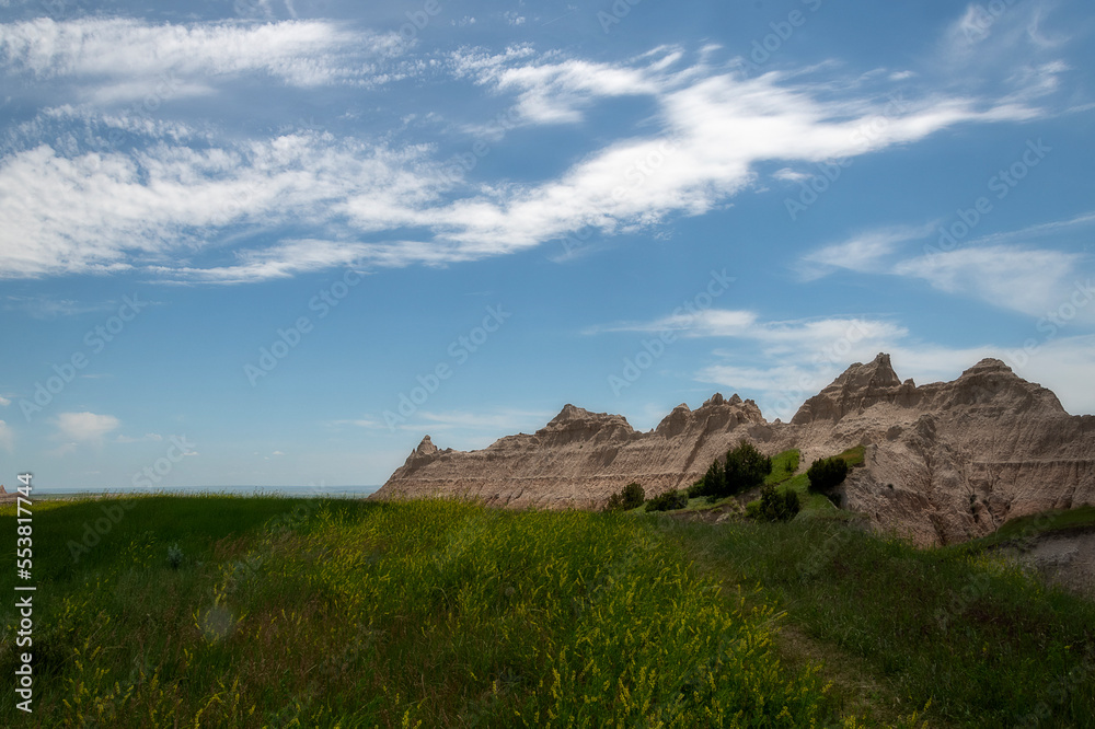 Fototapeta premium The rugged mountains of the Badlands. These geologic deposits contain one of the world’s richest fossil beds. Ancient mammals such as the rhino, horse, and saber-toothed cat once roamed here