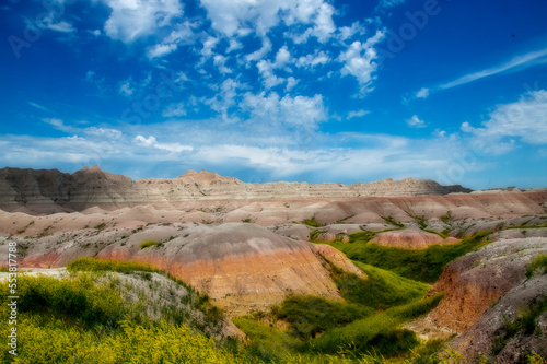 The rugged mountains of the Badlands. These geologic deposits contain one of the world’s richest fossil beds. Ancient mammals such as the rhino, horse, and saber-toothed cat once roamed here