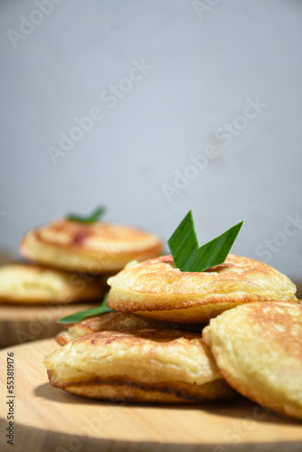 Kue Khamir or samir or Khamir cake on wooden plate. Khamir cake is a traditional snack from Pemalang, Indonesia. This cake is made from flour, butter and egg dough. Selective Focus photo