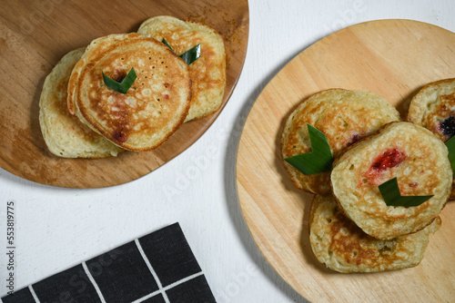 Kue Khamir or samir or Khamir cake on wooden plate. Khamir cake is a traditional snack from Pemalang, Indonesia. This cake is made from flour, butter and egg dough. Selective Focus photo