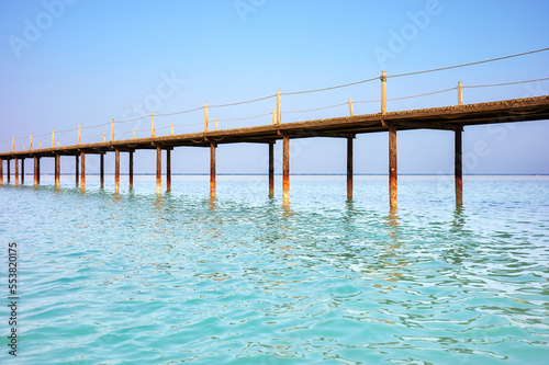 Picture of a wooden pier  tropical summer vacation concept.