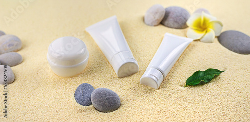 Cosmetics on the spa sea sand. Selective focus.