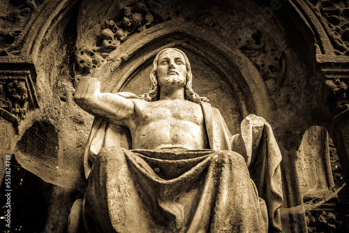 old jesus statue at a cemetery