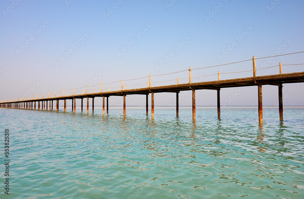 Picture of a wooden pier, tropical summer vacation concept.